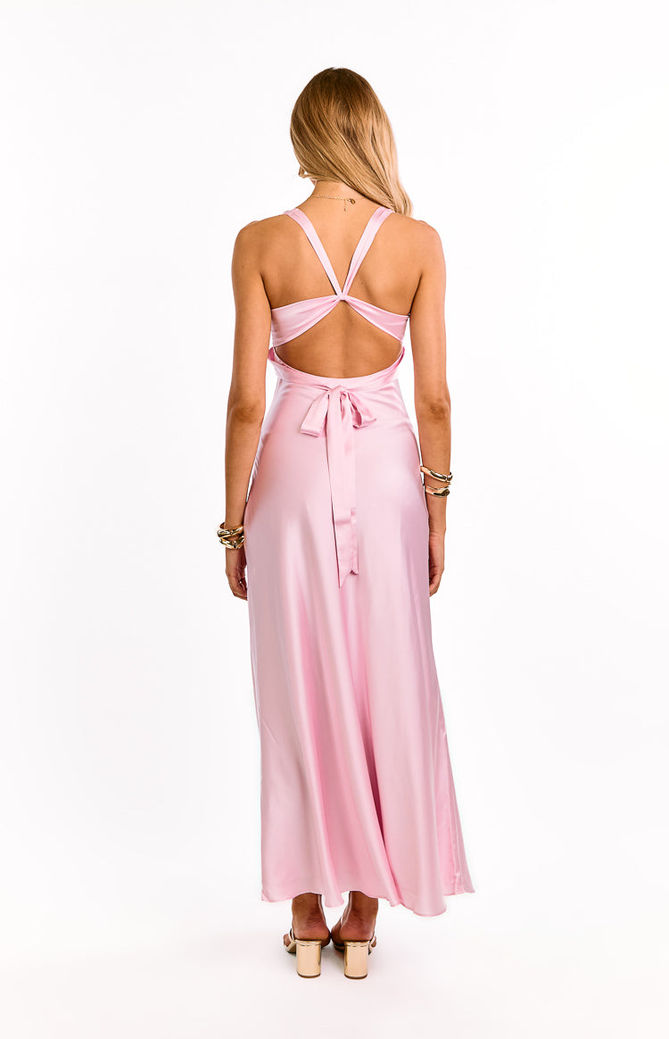 Rear view of the light pink maxi dress with criss-cross back straps, an open back, and a tie-waist