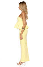 Side view of a yellow crepe maxi skirt with a fitted, straight-cut silhouette
