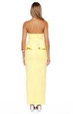 Back view of the yellow crepe maxi skirt, showing its fitted silhouette and central back seam