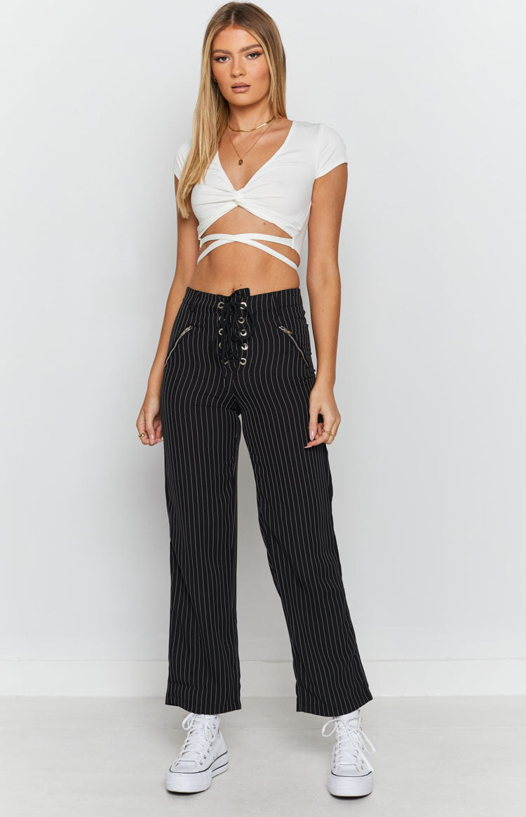 White V-neck crop top with short sleeves, twisted front knot, and wrap-around waist straps