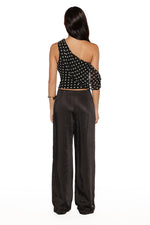 Rear view of black satin straight leg pants, highlighting the smooth back and fabric drape