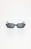 girl wearing black rectangle frame sunglasses with smokey black lenses