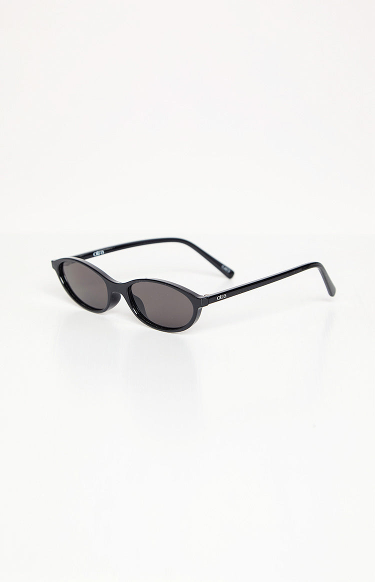 Slightly elevated front view of black cateye sunglasses with slim frames and dark tinted lenses
