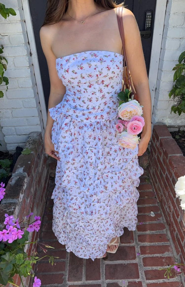 White floral strapless top with a fitted bodice and ruffled peplum waist