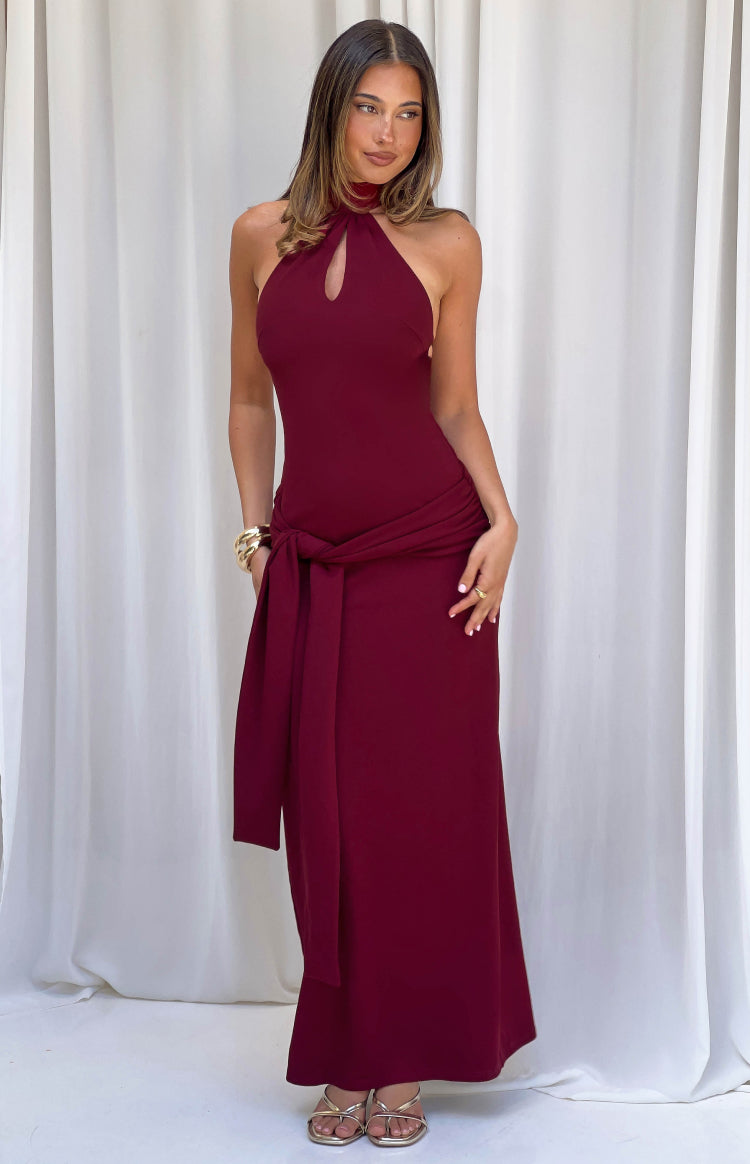 Burgundy jersey formal dress with a keyhole halter neckline and a self-tie waist detail