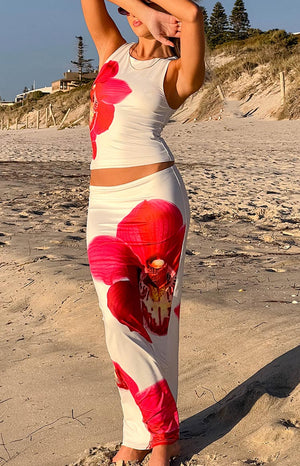 Beginning Boutique Payge White Orchid Maxi Skirt white fitted low-rise maxi skirt with a large pink orchid print