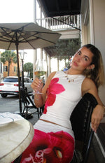 Beginning Boutique Payge White Orchid Maxi Skirt white fitted maxi skirt with a large pink orchid print