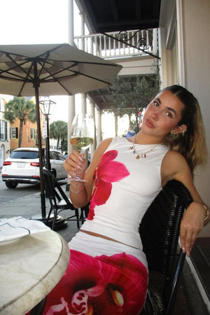 Beginning Boutique Payge White Orchid Maxi Skirt white fitted maxi skirt with a large pink orchid print