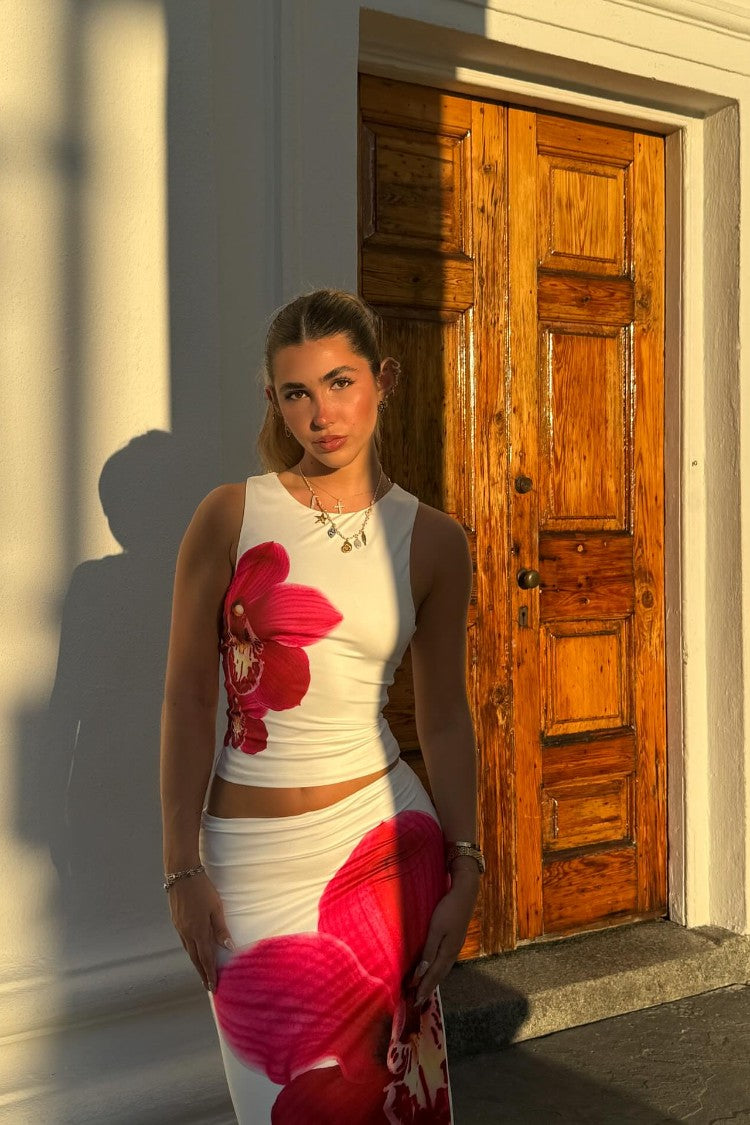 Beginning Boutique Payge White Orchid Maxi Skirt white fitted low-rise maxi skirt with a large pink orchid print