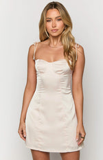 Front view of a cream satin mini dress with a sweetheart bust and tie-shoulder straps