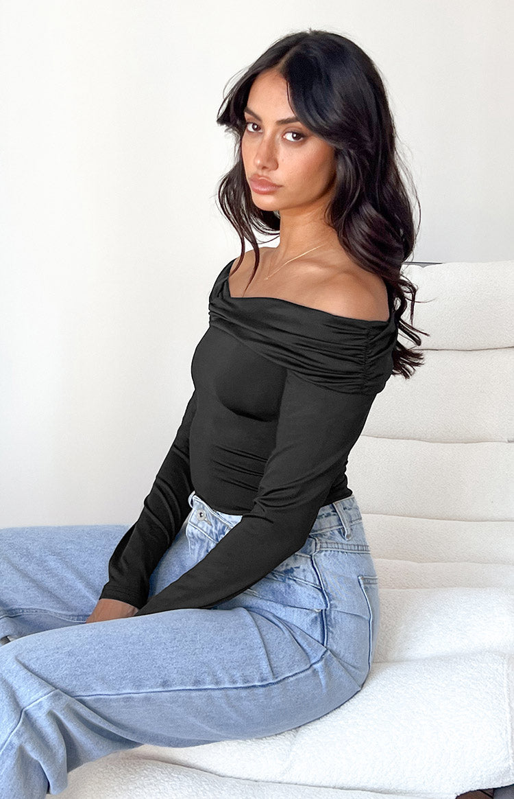 Side view of a black off-shoulder bodysuit with ruched neckline and long fitted sleeves