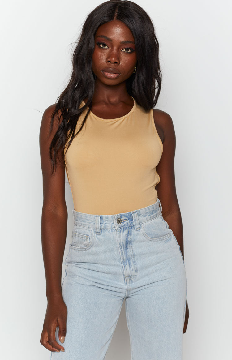 Beige jersey bodysuit with a high crew neckline and sleeveless design