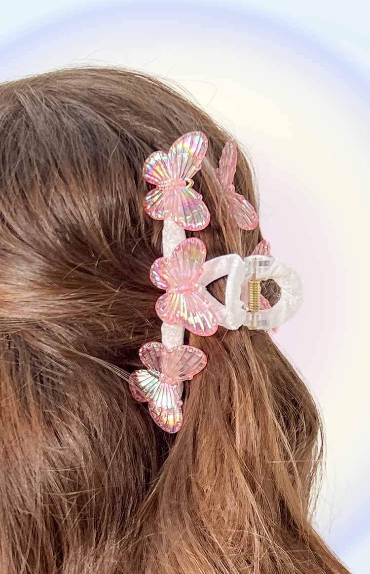 Side view of the pink iridescent butterfly claw clip with multiple iridescent butterflies