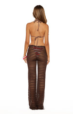 Rear view of sheer brown crochet wide-leg pants with a scalloped waistband and fringe hem