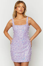 Close-up of the square neckline and thick straps with 3D flowers on a lavender mini dress with sequin and floral appliques