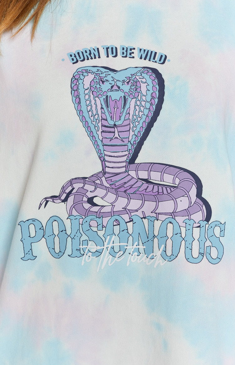 Light blue and pink tie-dye long sleeve sweater dress with a high roll neck and a bold cobra graphic