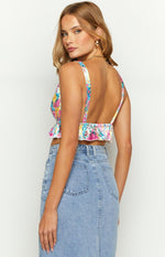 Rear view of a floral satin crop top with a low scoop back and ruffled elastic hem