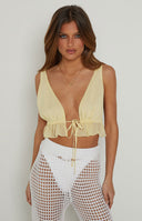 Beginning Boutique Poppy Yellow Crop Top yellow deep V-neck sleeveless crop top with tie-front and ruffled hem