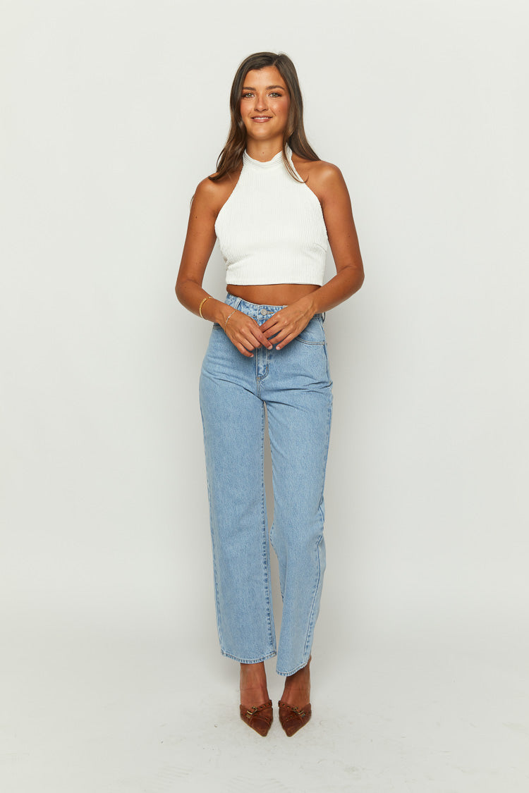 White ribbed knit halter crop top with a high neckline and fitted cropped silhouette