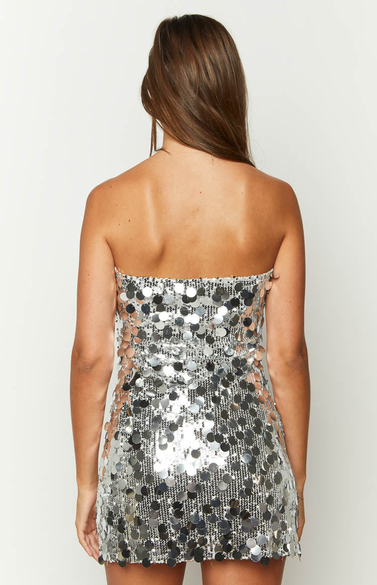 Close-up of the silver sequin fabric with small, tightly packed sequins and larger, round, dangling sequins