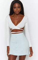 Pale blue knitted mini skirt with a row of matching round buttons down the front