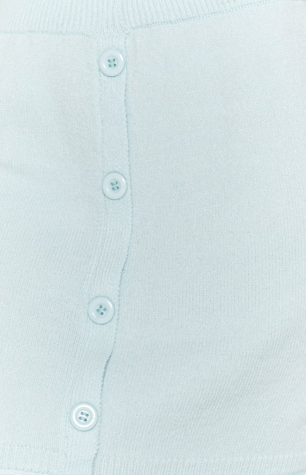 Soft light blue knit skirt fabric with a vertical row of four round matching buttons