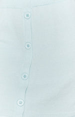 Soft light blue knit skirt fabric with a vertical row of four round matching buttons