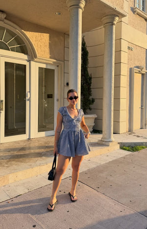 Beginning Boutique Raldo Black Gingham Playsuit black gingham V-neck playsuit with ruched bust, short puff sleeves, and flare