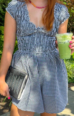 Beginning Boutique Raldo Black Gingham Playsuit black and white gingham playsuit with a shirred bodice, tie-front neckline, a