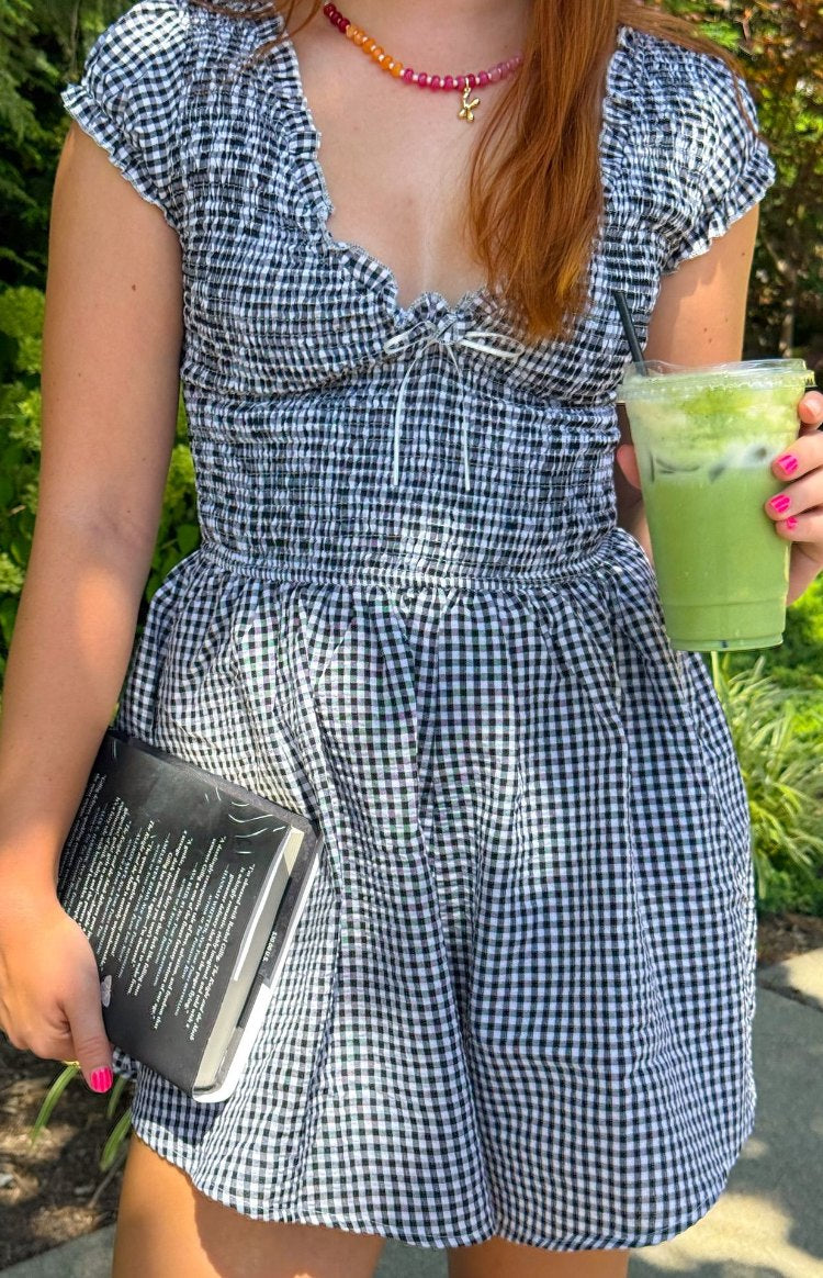 Beginning Boutique Raldo Black Gingham Playsuit black and white gingham playsuit with a shirred bodice, tie-front neckline, a