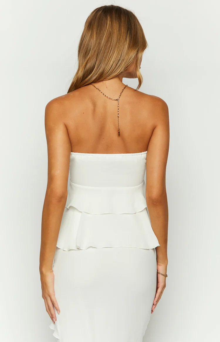 Rear view of a white strapless top with two tiered ruffles at the back