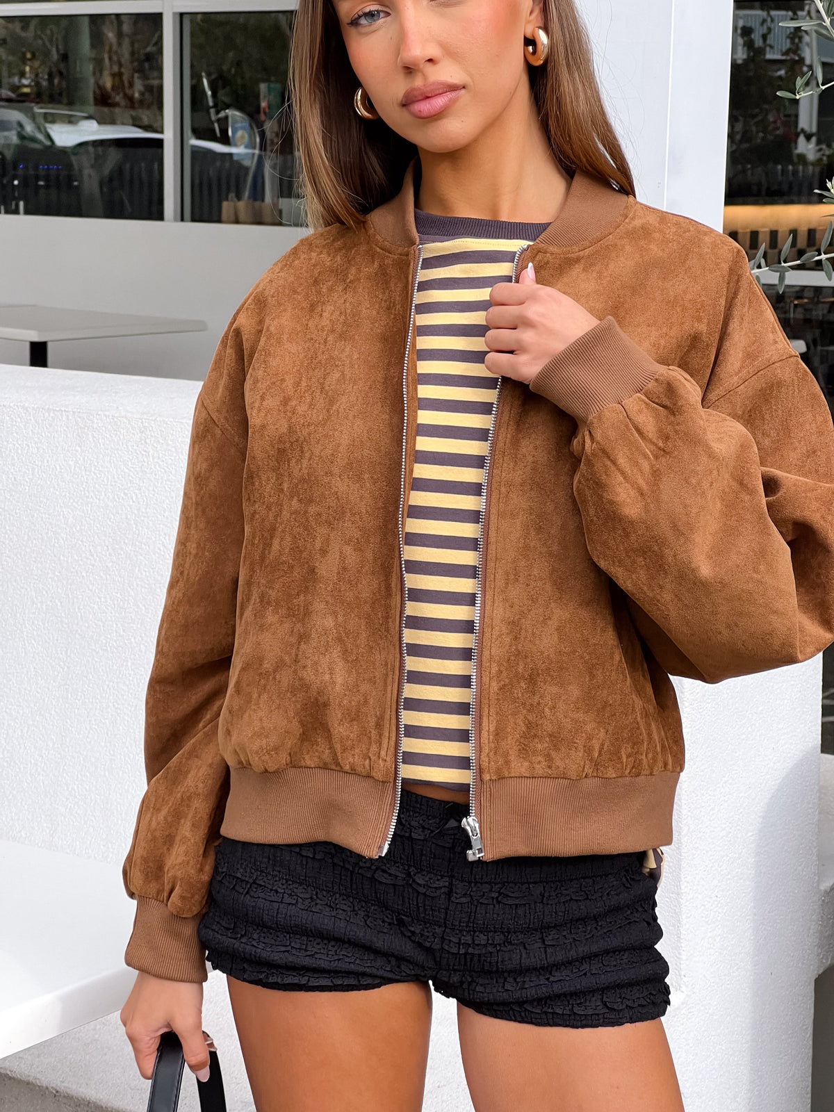 Beginning Boutique Rebecca Tan Cuffed Suedette Bomber Jacket tan suedette jacket with ribbed hem, full zip, and relaxed fit