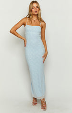 Light blue bodycon maxi dress with white geometric pattern and delicate lace trim at the hem