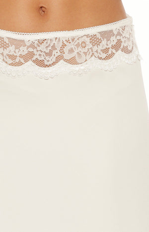 Close up of a white satin midi skirt with a delicate lace waistband romantic for a Date Night