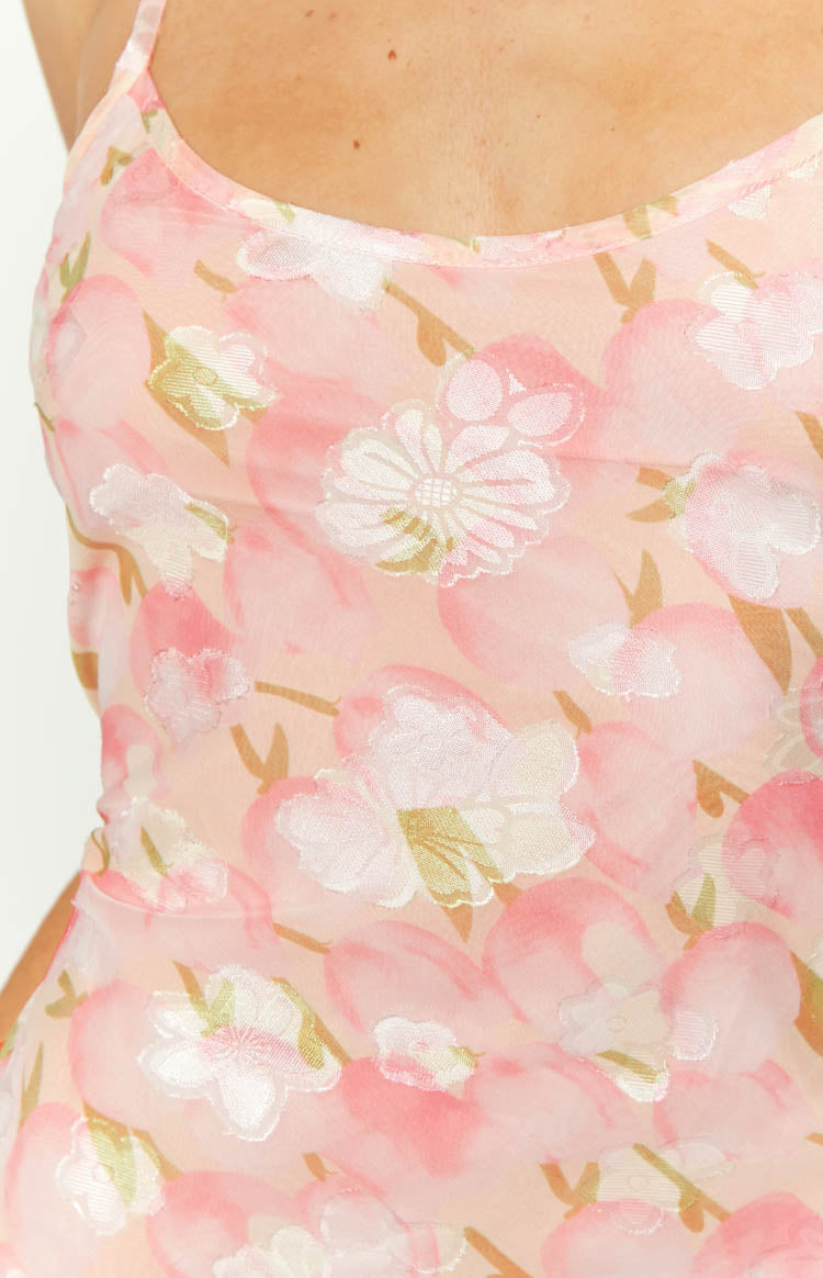 Pink floral chiffon maxi dress with a cowl neckline and thin spaghetti straps, showing the fitted bodice