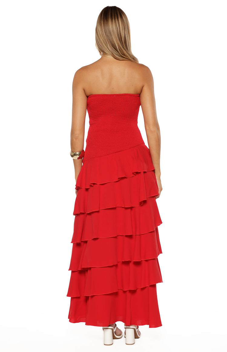 Rear view of a red strapless maxi dress with a smocked bodice and tiered ruffle skirt
