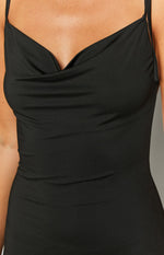 Close-up of the fitted black maxi dress bodice featuring a draped cowl neckline and thin adjustable spaghetti straps