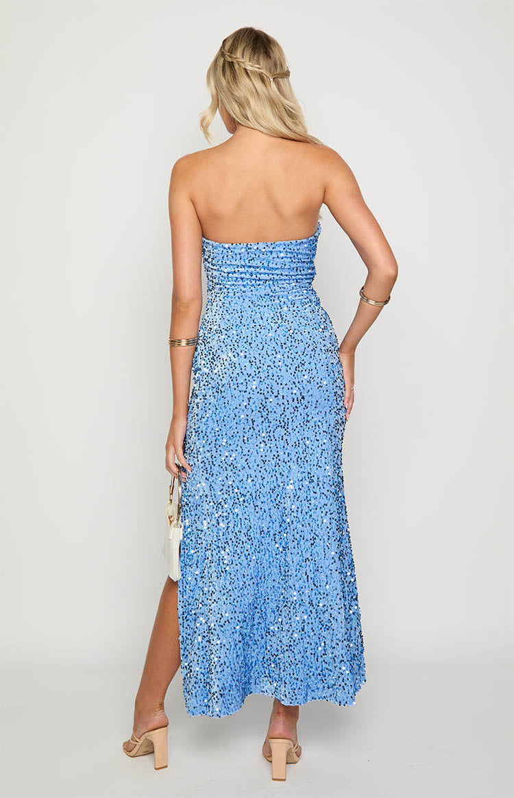 Back view of a blue sequin strapless maxi dress featuring a ruched bodice and a high leg slit