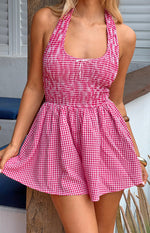 Red gingham halter playsuit with a shirred bodice and a small white bow detail at the neckline