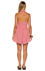 Rear view of a red gingham playsuit with a halter neck tie, shirred bodice, and elasticated waist