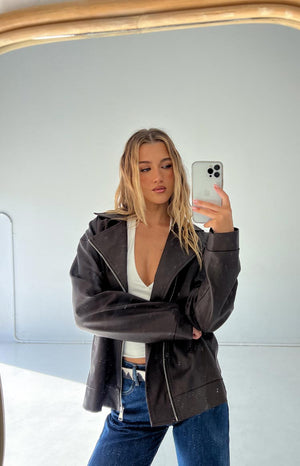 Chocolate brown PU oversized biker jacket with wide notched lapels and off-centre zipper