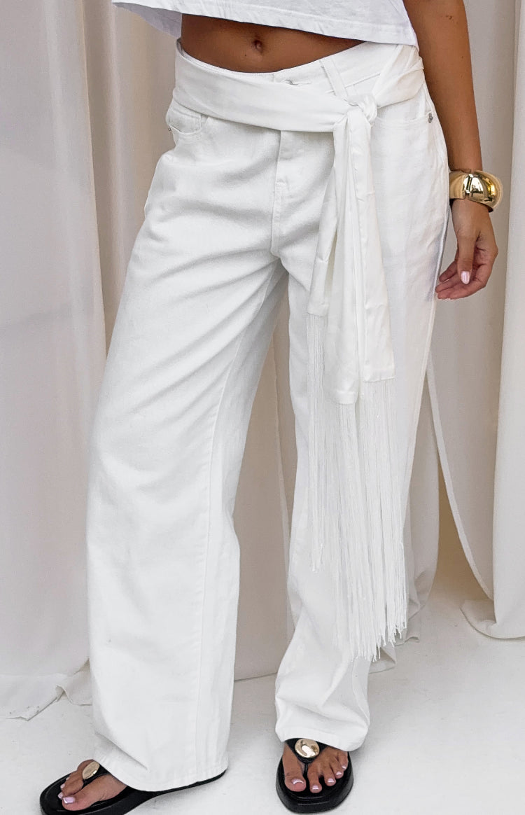 White satin fringe scarf belt tied at the side with a long fringed end hanging down