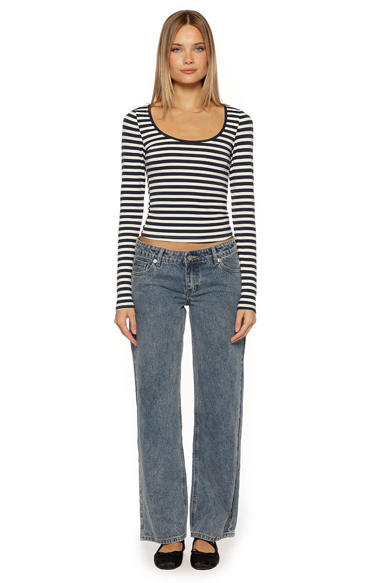 Front view of a navy and white striped long sleeve top with a scoop neck and cropped fit
