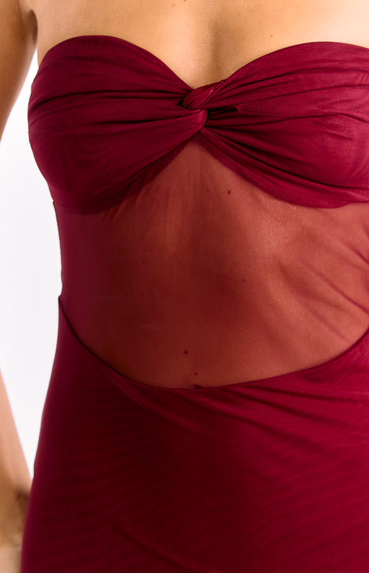 Close-up of the wine strapless maxi dress showing the twisted bust and sheer mesh midriff panel with cutout detail