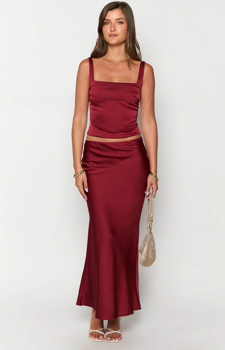 Burgundy satin maxi skirt with a high-waisted fit and elegant, flowing silhouette