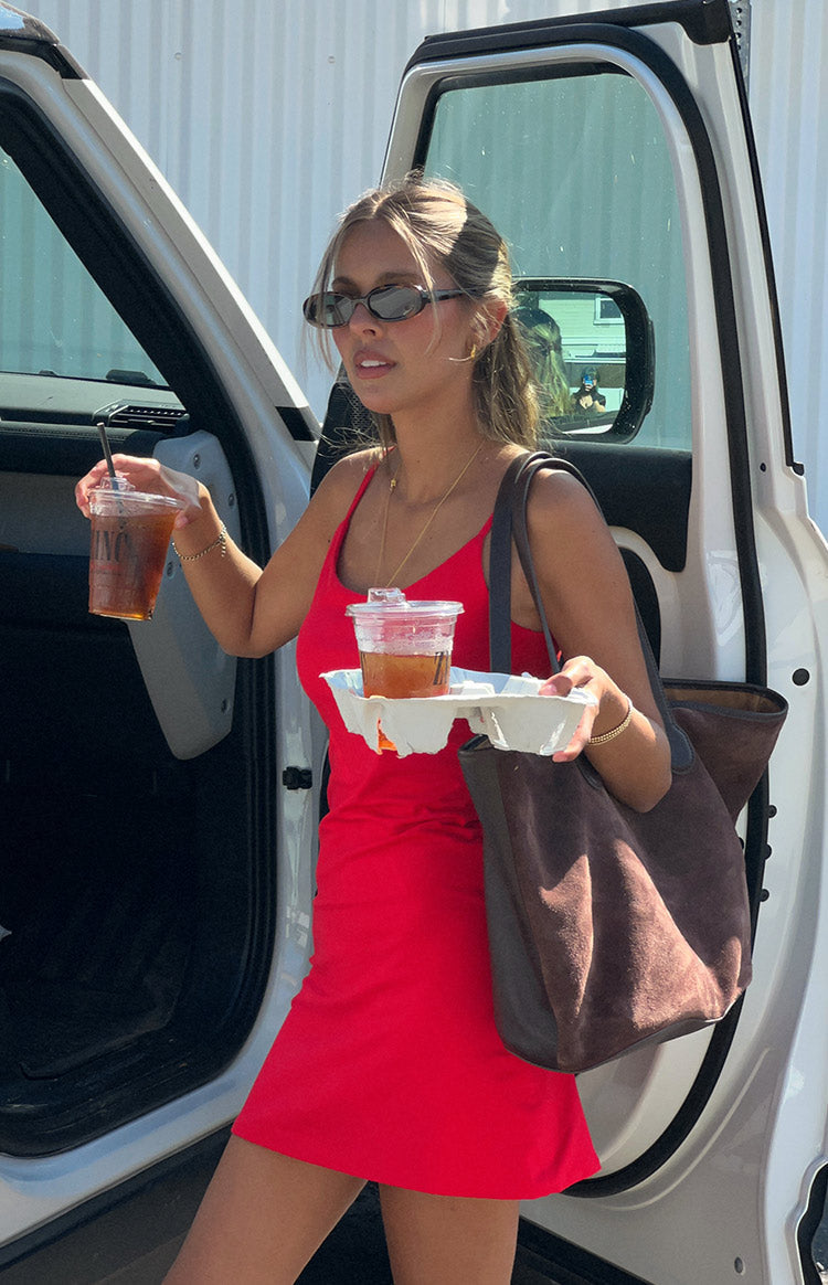 Front view of a red fitted mini dress with thin spaghetti straps and a scoop neckline
