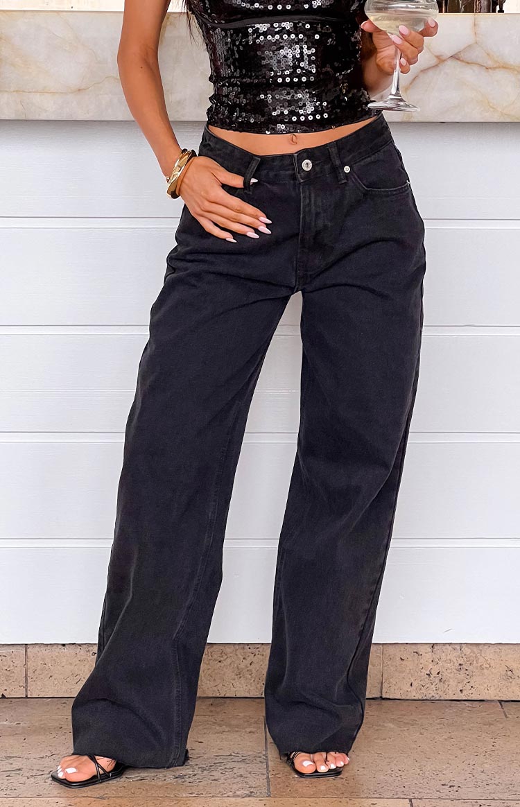 Full length view of black wide leg boyfriend jeans with a relaxed fit and high waist
