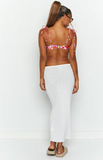 Rear view of a white sheer ribbed knit maxi skirt with a straight, body-skimming fit