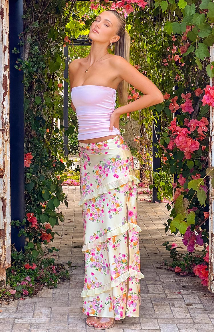 Beginning Boutique Saldana Yellow Bloom Maxi Skirt yellow satin floral print maxi skirt with tiered ruffles and a side slit