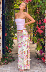 Beginning Boutique Saldana Yellow Bloom Maxi Skirt yellow satin floral print maxi skirt with tiered ruffles and a side slit